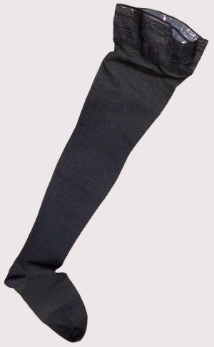 Varicose veins stockings showing a black thigh high self supporting stay up top with enclosed toe.