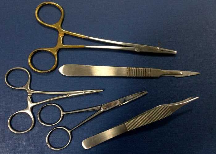Varicose vein stripping represented by a casual array of surgical instruments