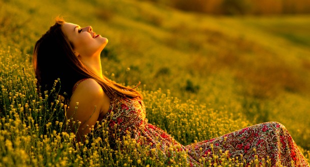 Woman bathing in sunlight in a meadow exemplifies a health-body rightly connected
